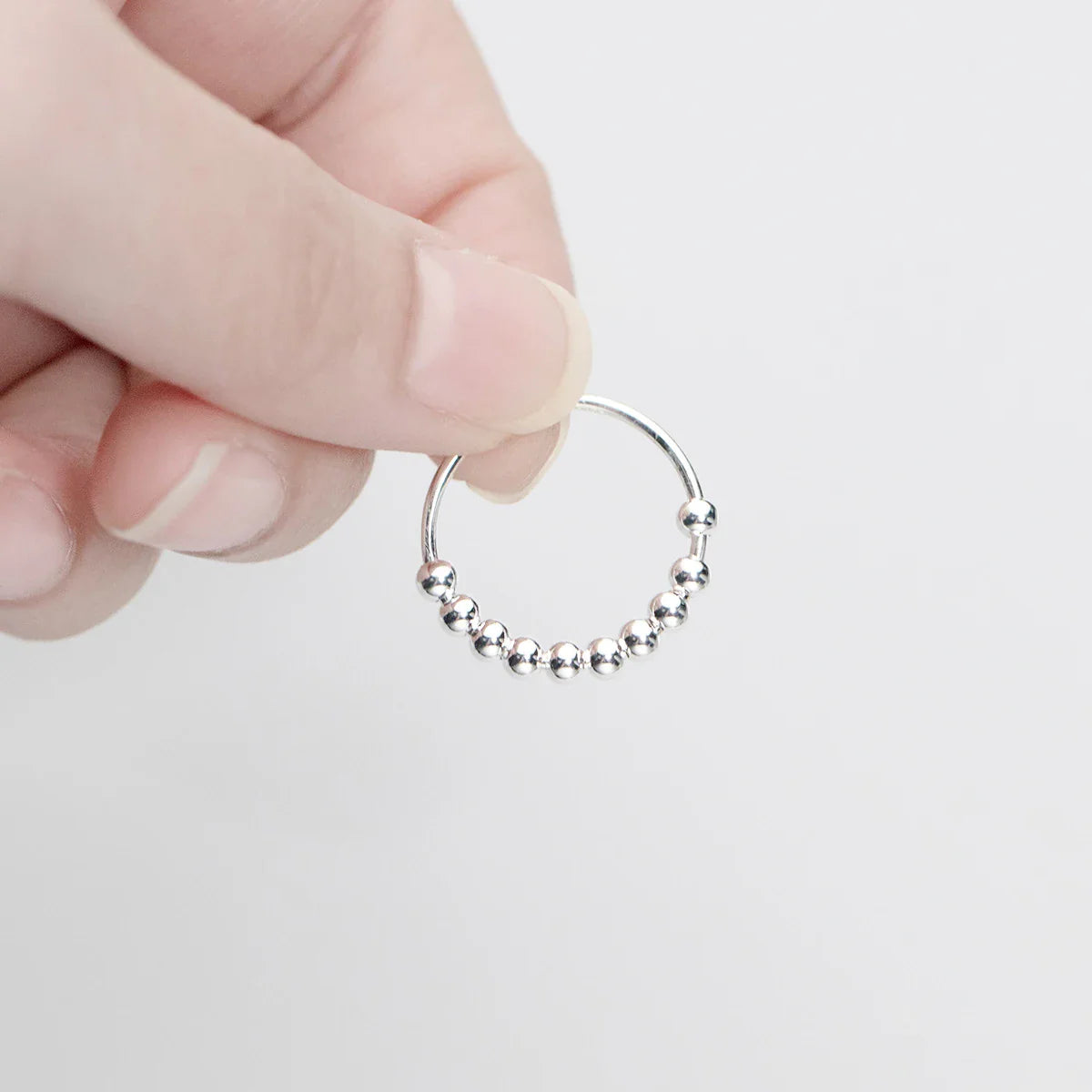 Anillo Antiestrés con Perlas Giratorias para Hombre o Mujer plata