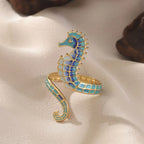 Anillo con concha y caballito de mar