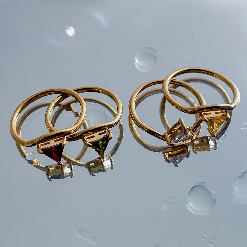 Gold-toned ring with a triangular birthstone