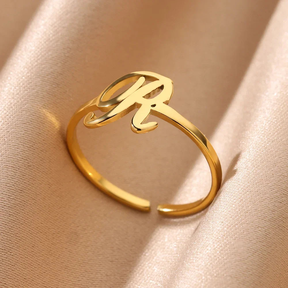 Slim ring decorated with an initial letter