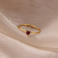 Slim gold-toned ring with heart-shaped birthstone