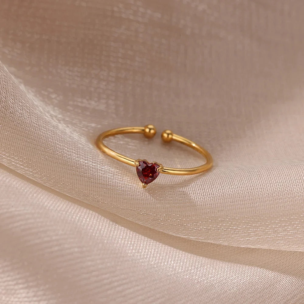 Slim gold-toned ring with heart-shaped birthstone