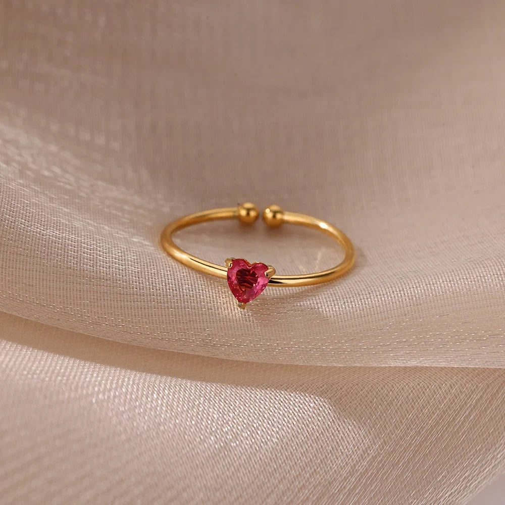 Slim gold-toned ring with heart-shaped birthstone