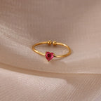 Slim gold-toned ring with heart-shaped birthstone