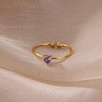 Slim gold-toned ring with heart-shaped birthstone