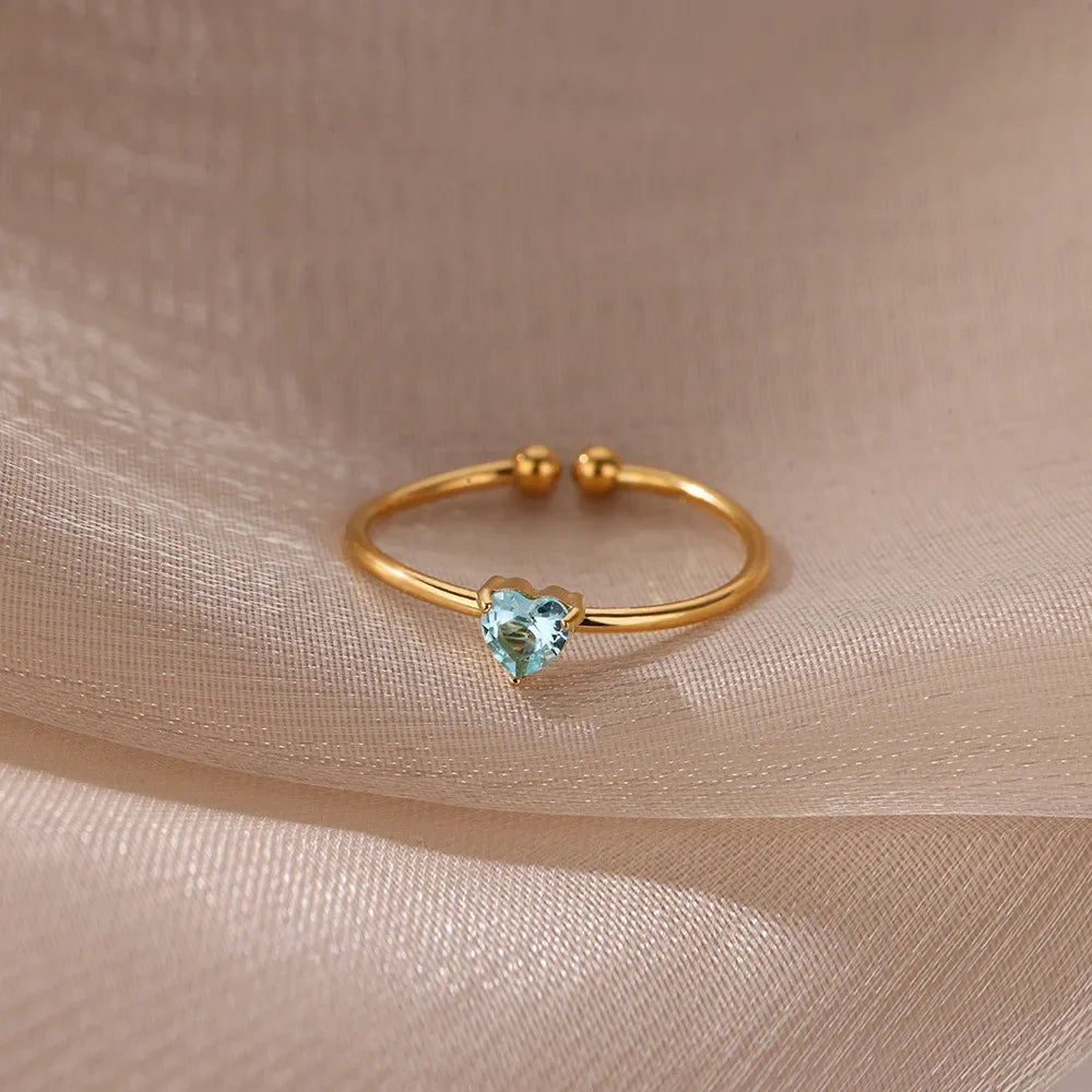 Slim gold-toned ring with heart-shaped birthstone