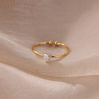 Slim gold-toned ring with heart-shaped birthstone