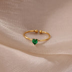 Slim gold-toned ring with heart-shaped birthstone