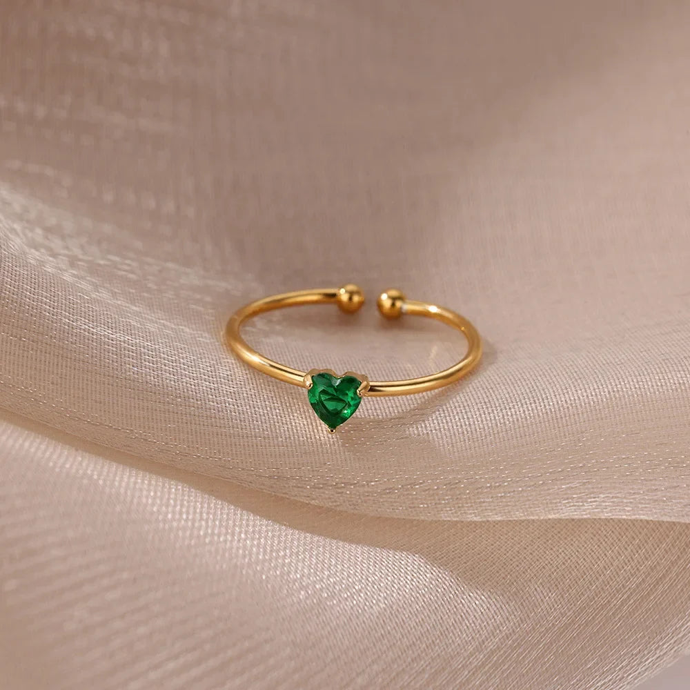 Slim gold-toned ring with heart-shaped birthstone