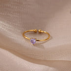 Slim gold-toned ring with heart-shaped birthstone