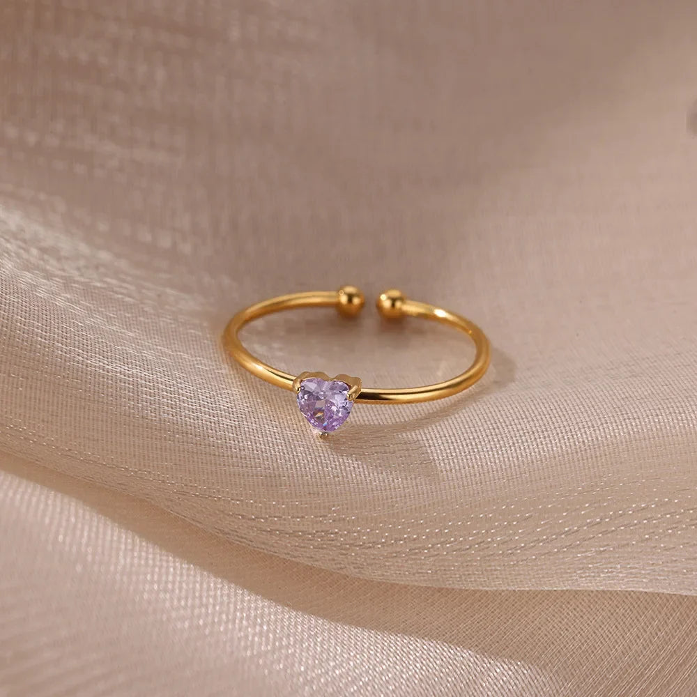 Slim gold-toned ring with heart-shaped birthstone