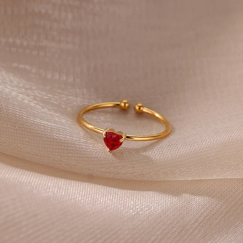 Slim gold-toned ring with heart-shaped birthstone