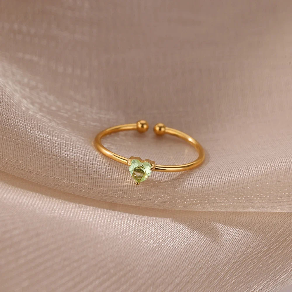 Slim gold-toned ring with heart-shaped birthstone