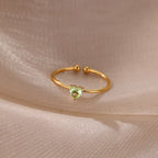 Slim gold-toned ring with heart-shaped birthstone