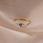 Slim gold-toned ring with heart-shaped birthstone
