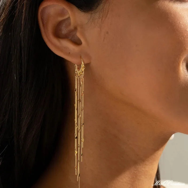 Boucles d'oreilles à pompons sublimant le visage