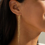 Pendientes con pompones que realzan el rostro 