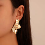 Pendientes de Perno Media Flor oro