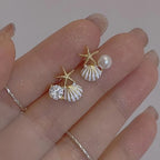 Pendientes de concha asimétricos 