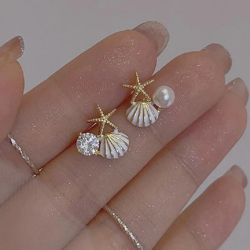 Pendientes de concha asimétricos 
