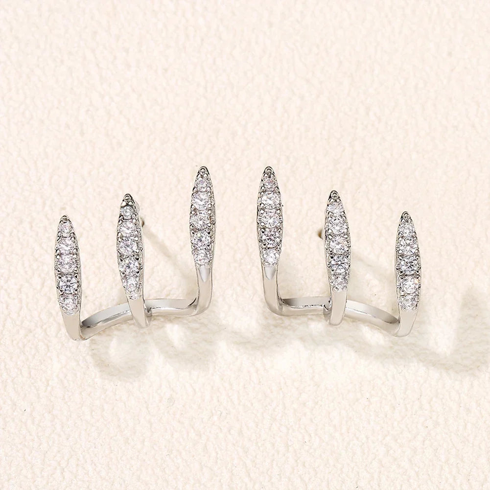 Boucles d'oreilles élégantes avec strass à trois griffes