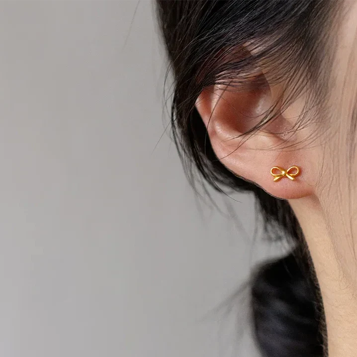 Boucles d'oreilles minimalistes noeud papillon or