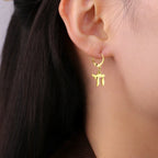 Boucles d'oreilles pendantes avec le symbole juif Chai or