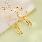 Boucles d'oreilles pendantes noeud papillon