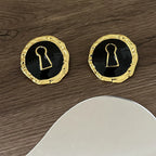 Boucles d'oreilles rondes clef noir