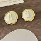 Pendientes redondos con llave / cerradura