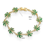 Bracelet avec breloques de palmiers en émail vert