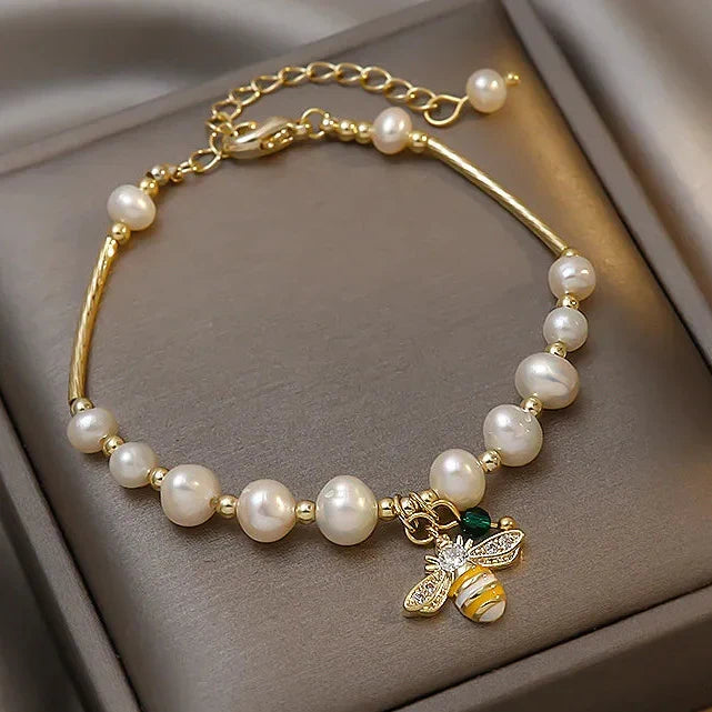 Bracelet avec perles blanches abeille