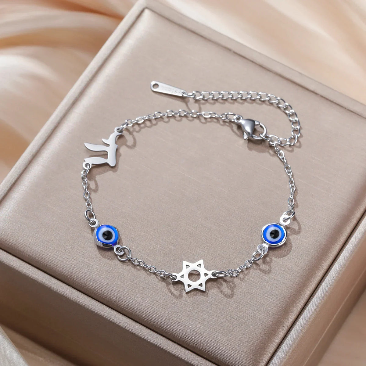 Bracelet with protective symbols: blue eye, Chai, and the Star of David 