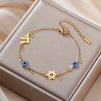 Bracelet with protective symbols: blue eye, Chai, and the Star of David 