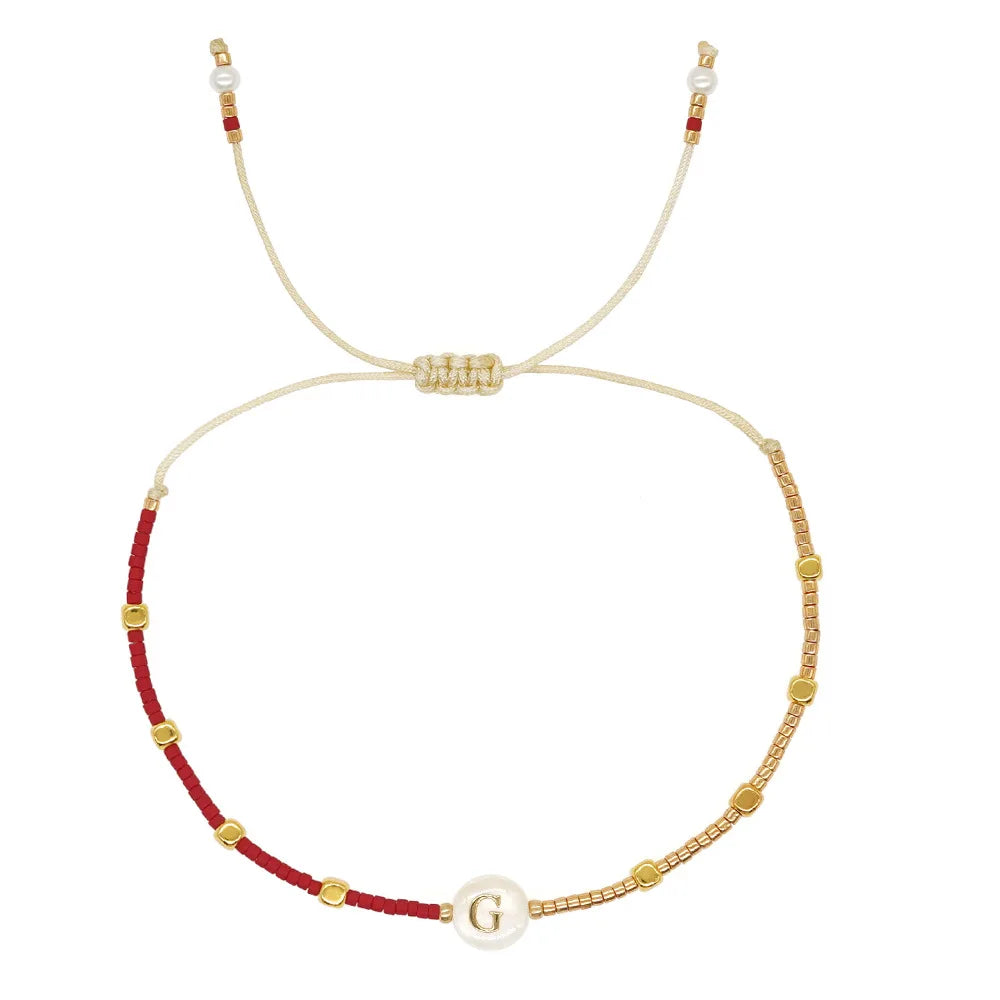 Two-tone initial letter bracelet