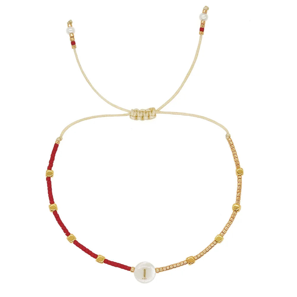 Two-tone initial letter bracelet