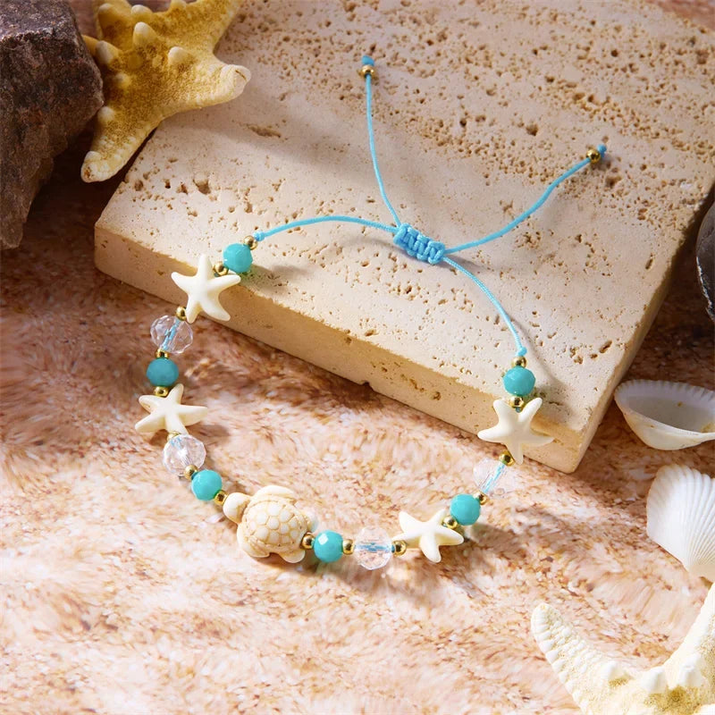 Pulsera de cordón con concha y estrella de mar 