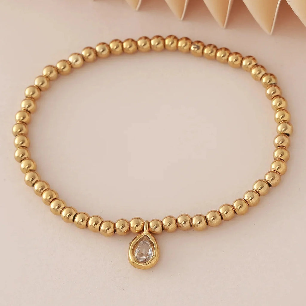 Bracelet doré avec pierre de naissance pour femme