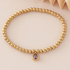 Pulsera dorada con piedra de nacimiento para mujer 