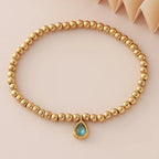 Pulsera dorada con piedra de nacimiento para mujer 