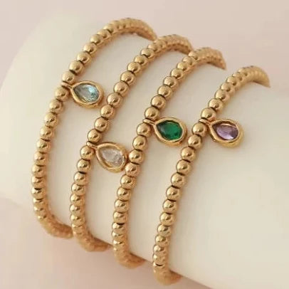 Bracelet doré avec pierre de naissance pour femme