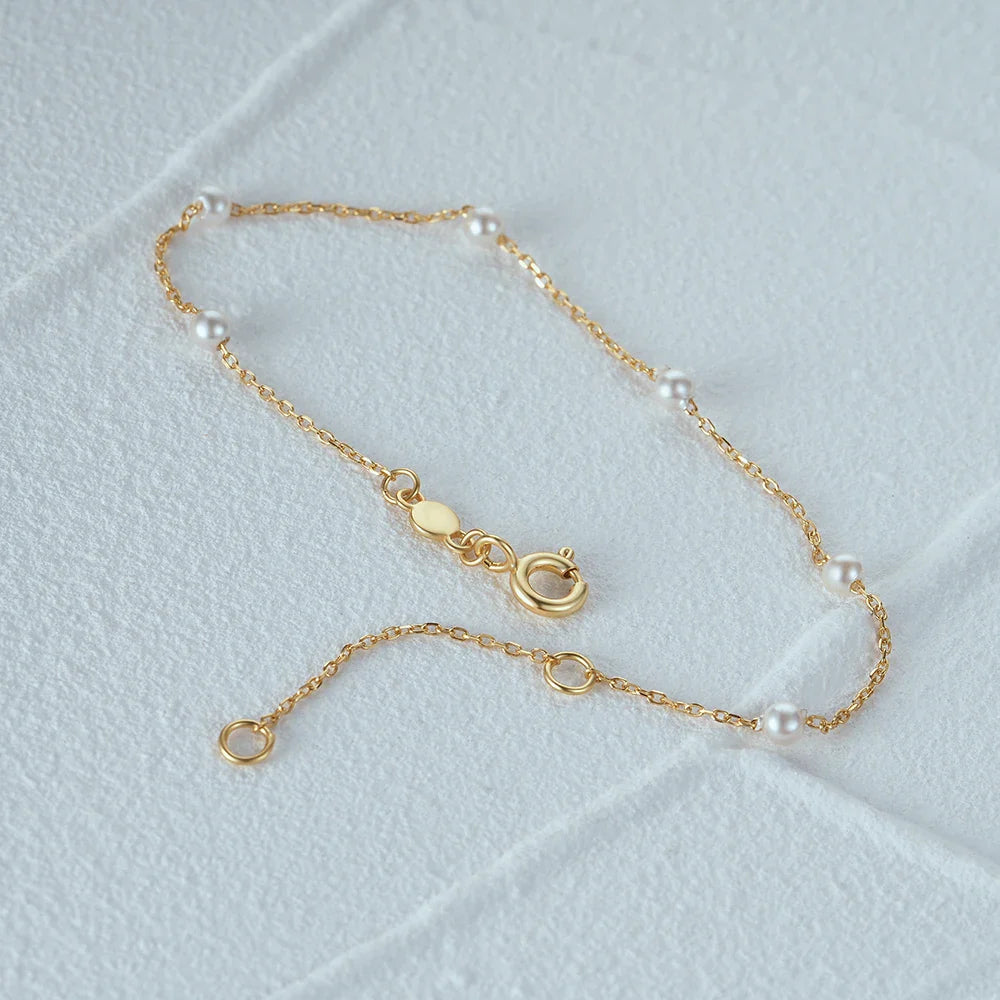 Pulsera de cadena fina con perlas blancas