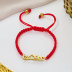 Braided Bracelet with Red and Gold Mountain Pendant