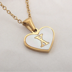 Collier avec pendentif coeur blanc initiale x
