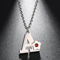 Collier avec pendentif initiale et fleur 