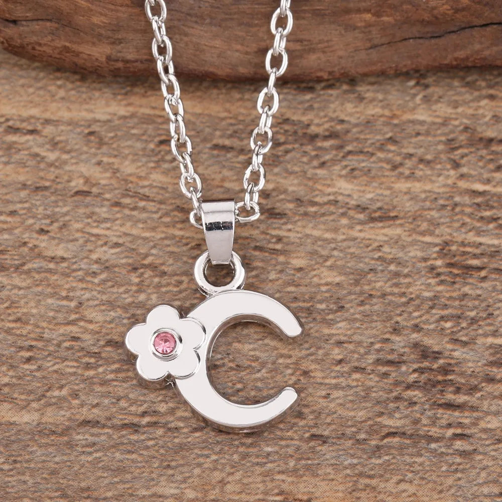 Necklace with flower pendant and initial letter