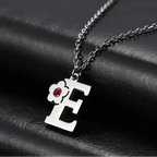 Necklace with flower pendant and initial letter