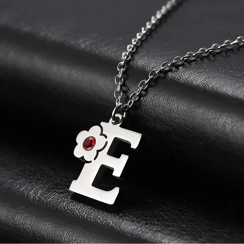 Necklace with flower pendant and initial letter