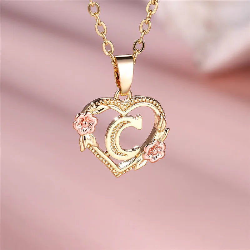 Necklace with heart and flower initial letter pendant