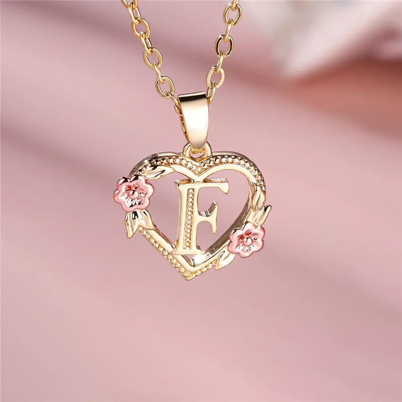 Necklace with heart and flower initial letter pendant